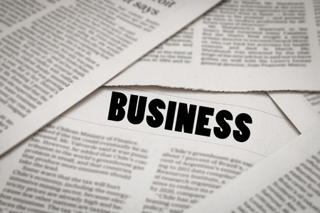business analysis concept with newspaper backgroundの写真素材