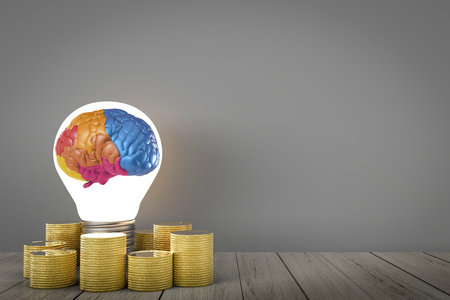 idea make money concept with colorful brain in light bulb and gold coinsの写真素材
