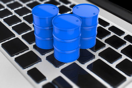 oil price online concept with 3d rendering blue barrels on keyboard