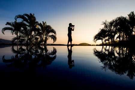 silhouette photographer with twilight sky backgroundの写真素材