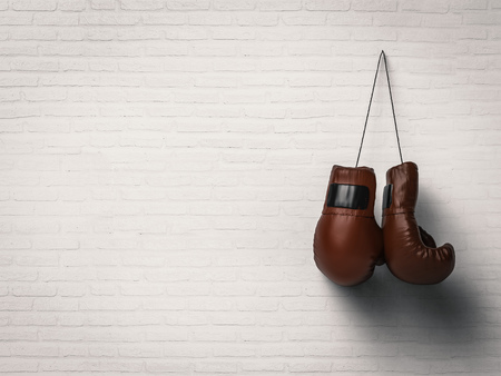 3d rendering red boxing gloves hanging on white wallの写真素材