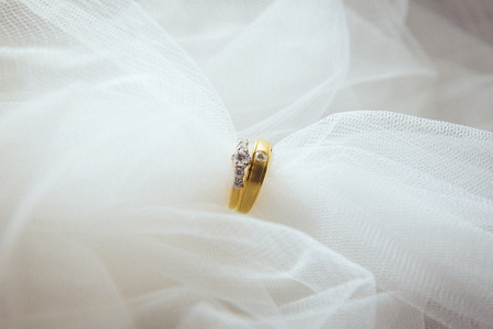 two wedding rings with diamondの写真素材