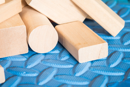 wooden toys on blue mat