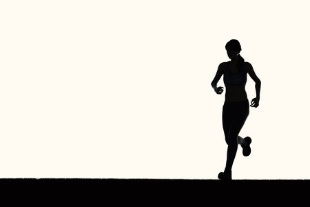 silhouette woman running or female runnerの写真素材