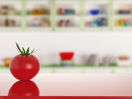 tomato on red counter with kitchen backgroundの写真素材