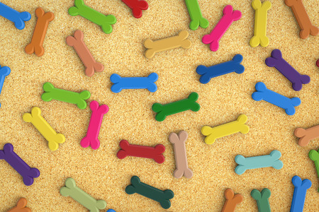 colorful dog bones on yellow backgroundの写真素材