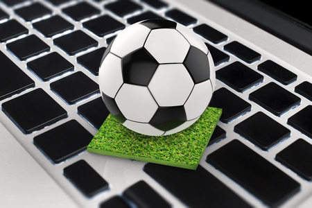 3d rendering soccer ball on computer keyboardの写真素材