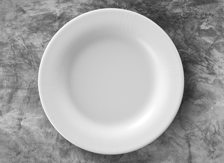empty white dish on grey backgroundの写真素材