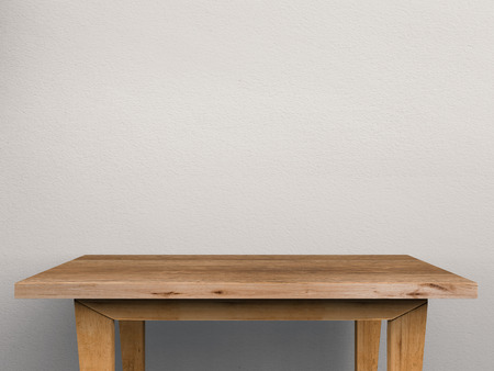 empty wooden table on grey background