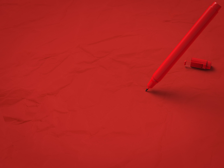 red pen on red backgroundの写真素材