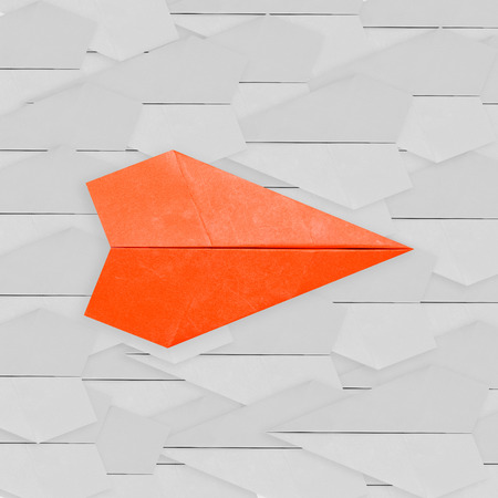 differentiation concept with orange paper planeの写真素材