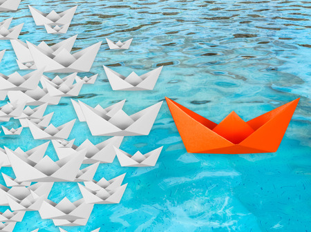 leadership concept with paper boat floatingの写真素材