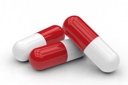 heap of capsule pill on white backgroundの写真素材