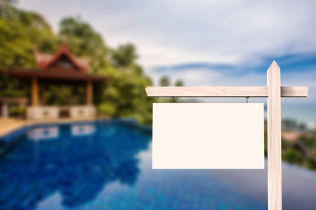 blank white sign with exterior house backgroundの写真素材