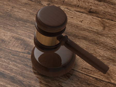 3d rendering gavel judge on wooden backgroundの写真素材