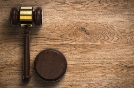 3d rendering gavel judge on wooden backgroundの写真素材