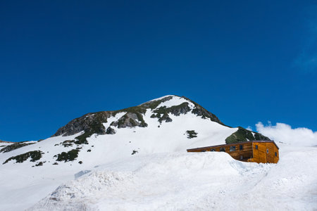 TATEYAMA, JAPAN - June 11, 2017: Japan Alps with melting snow. The Tateyama Kurobe Alpine route operate in late April until November, is one of the tourist attraction in Japan.のeditorial素材