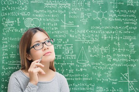 asian woman learning or solving problem with blackboard background