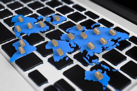 3d rendering cardboard boxes on world map with computer notebookの写真素材