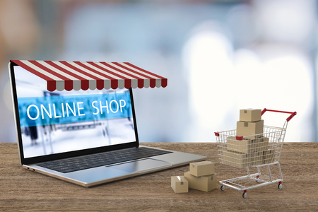 online shopping concept with 3d rendering computer notebook and shopping cart の写真素材