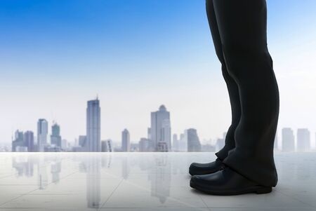 3d rendering businessman standing with cityscape background
の写真素材