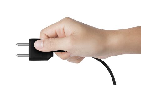 Human hand hold black electric plug isolated on white