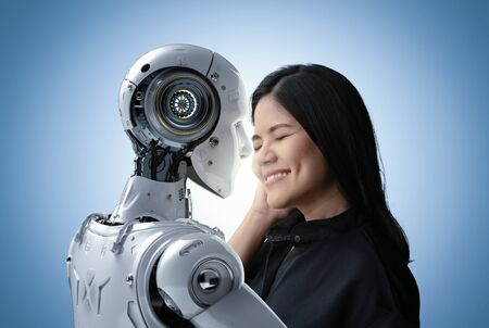 Asian woman happy living with cyborg or robotの写真素材