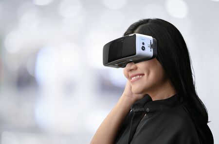 Asian woman wear vr headset and enjoy experienceの写真素材