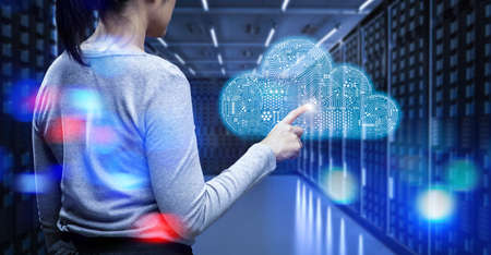 Cloud computing technology with server room and worker with graphic displayの写真素材