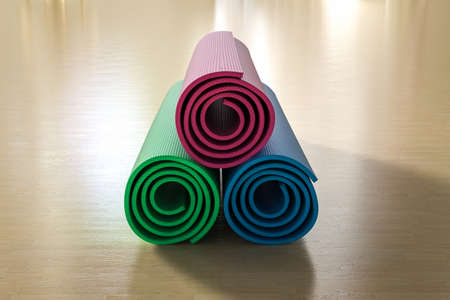 3d rendering heap of colorful yoga mats on the floorの写真素材