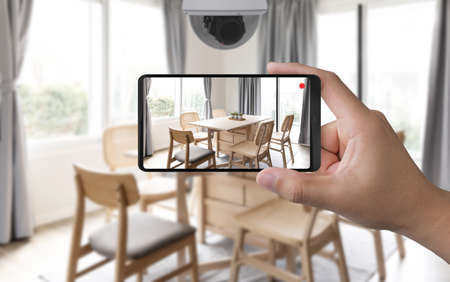 3d rendering mobile connect with home security cameraの写真素材