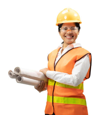 Asian engineer or technician wear safety helmet and reflective vest hold blueprint paperの写真素材