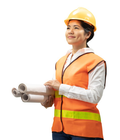 Asian engineer or technician wear safety helmet and reflective vest hold blueprint paper