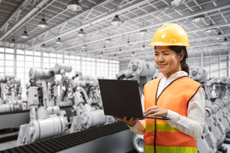 Technician or engineer work with 3d rendering robotic arms in factory