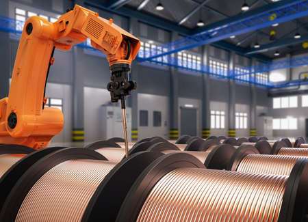 Automation factory concept with 3d rendering robotic arm with rolls of copper wire in factoryの写真素材
