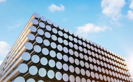 3d rendering heap of shiny aluminium billets in factoryの写真素材