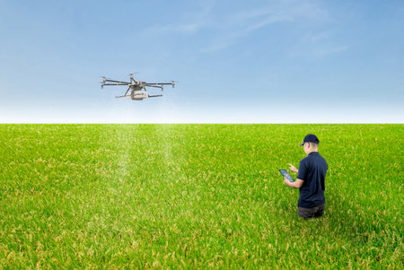 Agriculture technology concept with agricultural engineer control drone fly aboveの写真素材
