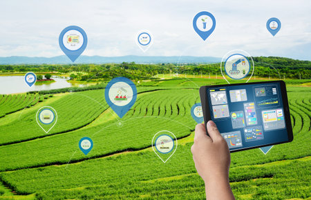 Agriculture technology concept with agricultural engineer or farmer work with tablet in farm