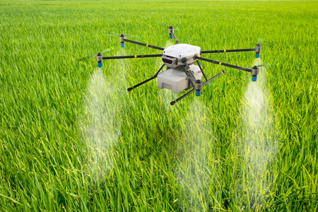 Agriculture technology concept with 3d rendering drone fly above and spray fertilizerの写真素材