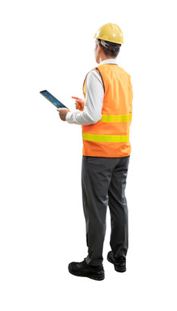 Asian engineer or technician full body length hand holding digital tablet wear safety helmet and reflective vest isolated on whiteの写真素材