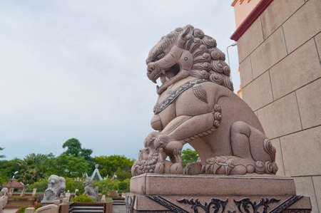 Lion statue outside buddist templeの写真素材