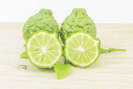 kaffir lime on wooden floorsの写真素材