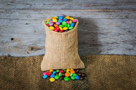 sweet color candy on sackclothの写真素材