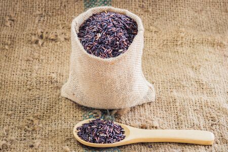 brown rice with in spoon backgroundの写真素材