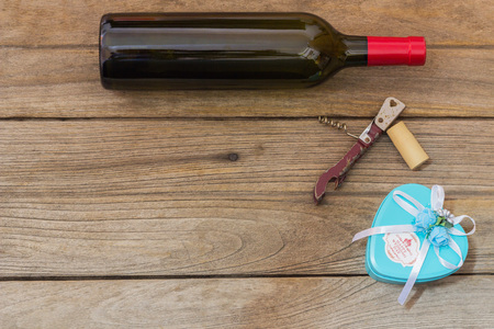 wine bottle and corkscrew on a paper backgroundの写真素材