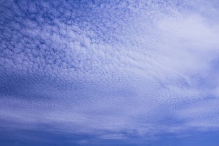 Fantastic soft white clouds against blue sky