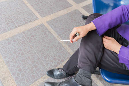 man smoking a cigaretteの写真素材