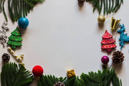 Christmas background with decorations and gift boxes on wooden boardの写真素材