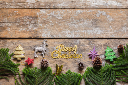 Christmas background with decorations and gift boxes on wooden boardの写真素材