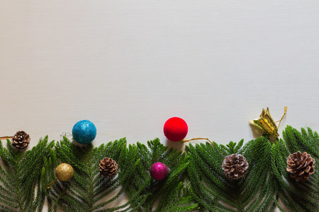 Christmas background with decorations and gift boxes on wooden boardの写真素材